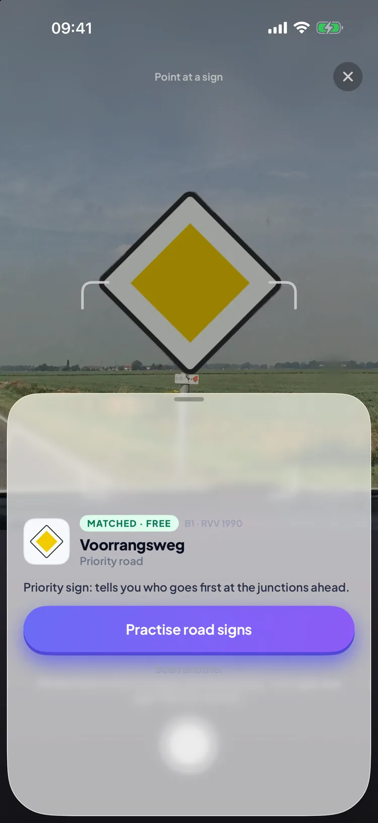 Permio Scan a sign screen pointed at a priority road sign, matched as Voorrangsweg (B1) with a button to practise road signs
